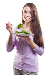 Image showing Woman eating salad