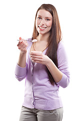 Image showing Woman eating yogurt