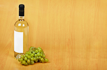 Image showing Open arrangement of bottle of white wine