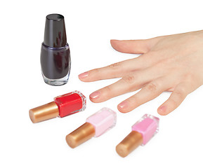 Image showing Female hand and choice of color nail polish