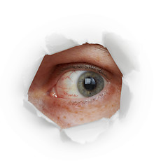 Image showing Human eye looks through hole