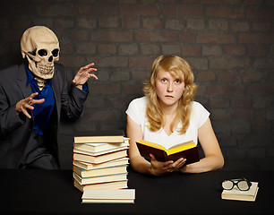 Image showing Woman reads a scary books