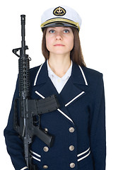 Image showing Woman in uniform sea captain with rifle, isolated on white backg