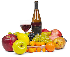 Image showing Bottle and glass of red wine among fruit - still life