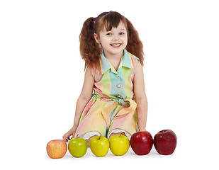 Image showing Happy child with apples of different color and size