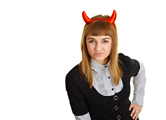 Image showing Young woman with devil horns, sly looks