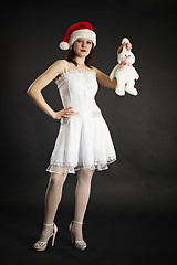 Image showing Girl in white dress holding white rabbit