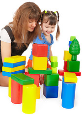 Image showing Mother and daughter playing with color toys