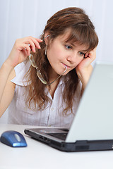 Image showing Young beautiful woman with concentration studies laptop