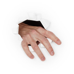 Image showing Hand breaks through white paper