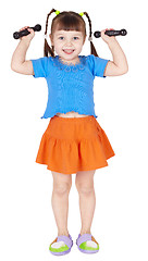 Image showing Athletic child is doing dumbbell