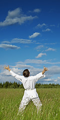 Image showing Person has lifted hands to blue sky - happiness