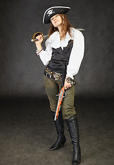 Image showing Girl dressed as pirate on black with sword