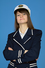 Image showing Portrait of the proud woman - captain on blue