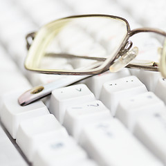 Image showing Spectacles lie on keyboard