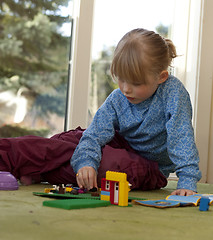 Image showing Child playing with bricks