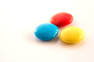 Image showing three colored candy buttons