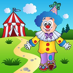 Image showing Smiling clown with circus tent