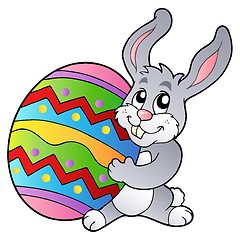 Image showing Cartoon bunny holding Easter egg