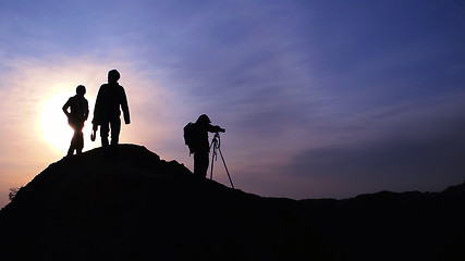 Image showing Silhouette of photographers at sunrise