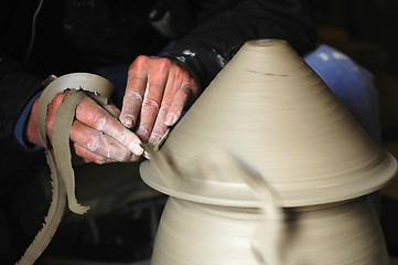 Image showing Making a porcelain vase with clay