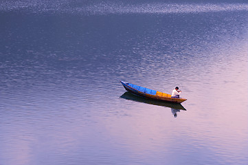Image showing Scenery of a lake with a fishing boat
