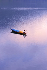 Image showing Scenery of a lake with a fishing boat