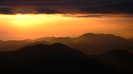 Image showing Sunrise at the top of mountains