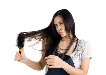 Image showing woman brushing her hair