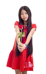 Image showing asian teenager holding a rose