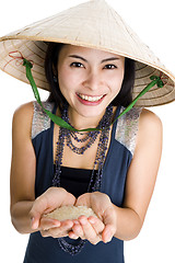 Image showing  woman with rice in her hands