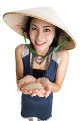 Image showing  woman with rice in her hands