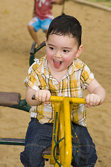 Image showing cute boy on a carousel