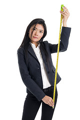 Image showing business woman with ruler 