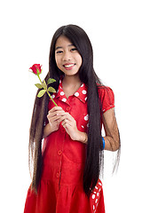 Image showing asian teenager holding a rose