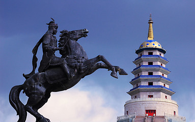 Image showing Statue of Mongolian saber and a Pagoda