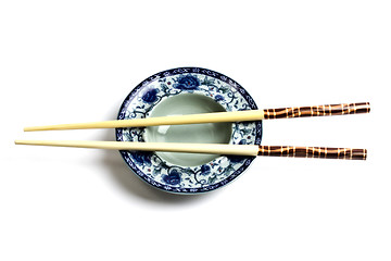 Image showing Wood chopsticks and plate
