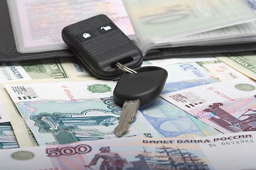 Image showing autodocuments and a car key