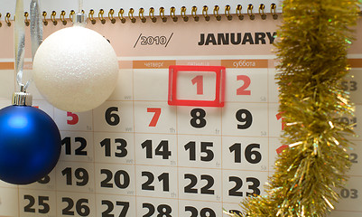 Image showing Calendar and New Year's ornaments.