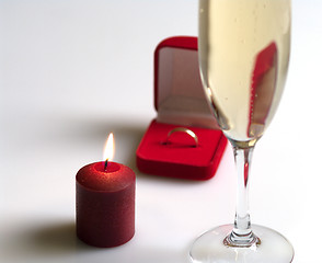 Image showing Still life with a candle and champagne.