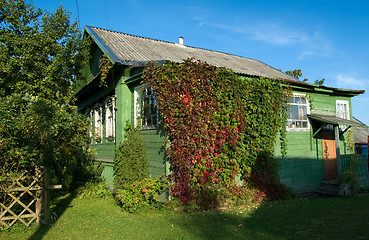 Image showing The green wooden house.