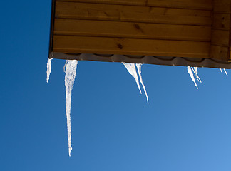 Image showing Icicles on a roof.