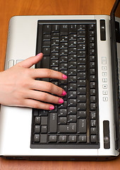 Image showing Laptop and hand.