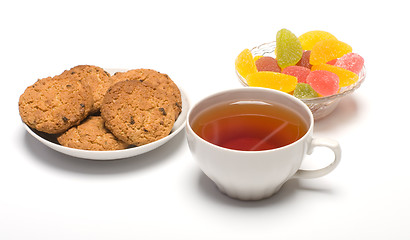 Image showing Tea, cookies and fruit candy.