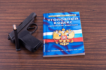 Image showing Pistol and book.