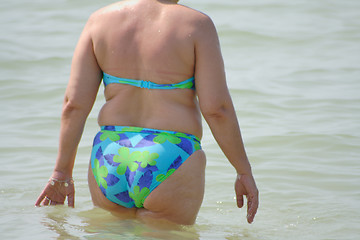 Image showing fat lady on beach