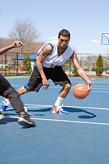 Image showing Men Playing Basketball One On One