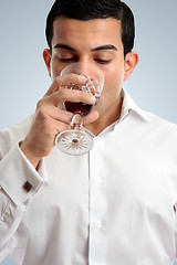 Image showing Man tasting drinking wine