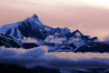 Image showing Snow mountains in clouds