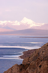 Image showing Blue lake and snow mountains at sunrise